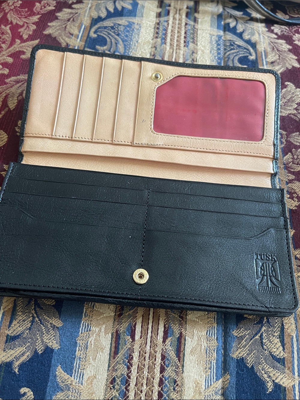 Tusk Embossed Black & Tan Bi-Fold Wallet